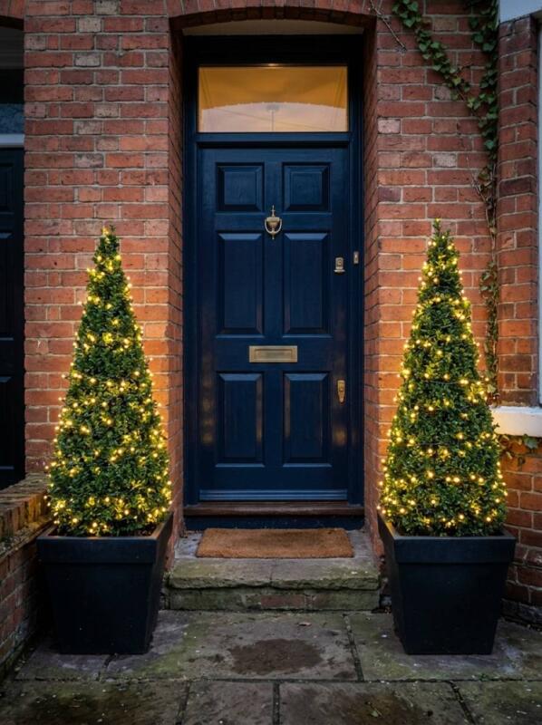 Lit Cone Topiary in Black Pots – Christmas planter idea for UK homes