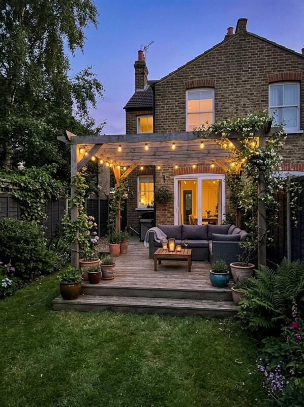 A Deck with Pergola and String Lights – garden decking idea for UK gardens