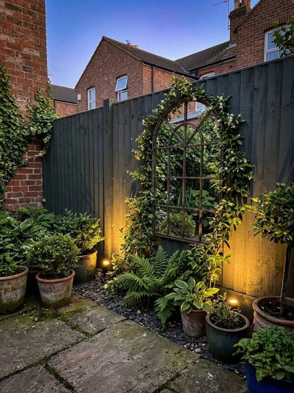 A Mirror Arch and Pots at Dusk – garden fence idea for UK gardens
