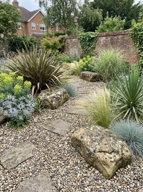 A Gravel Garden with Grasses and Stones – low maintenance garden idea for UK gardens