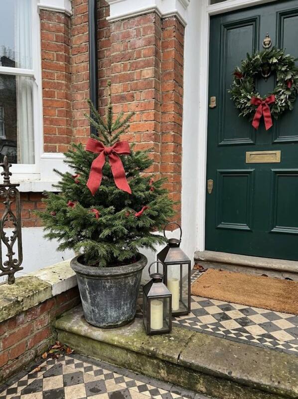 A Doorstep Spruce with Lanterns – outdoor Christmas tree idea for UK gardens and porches