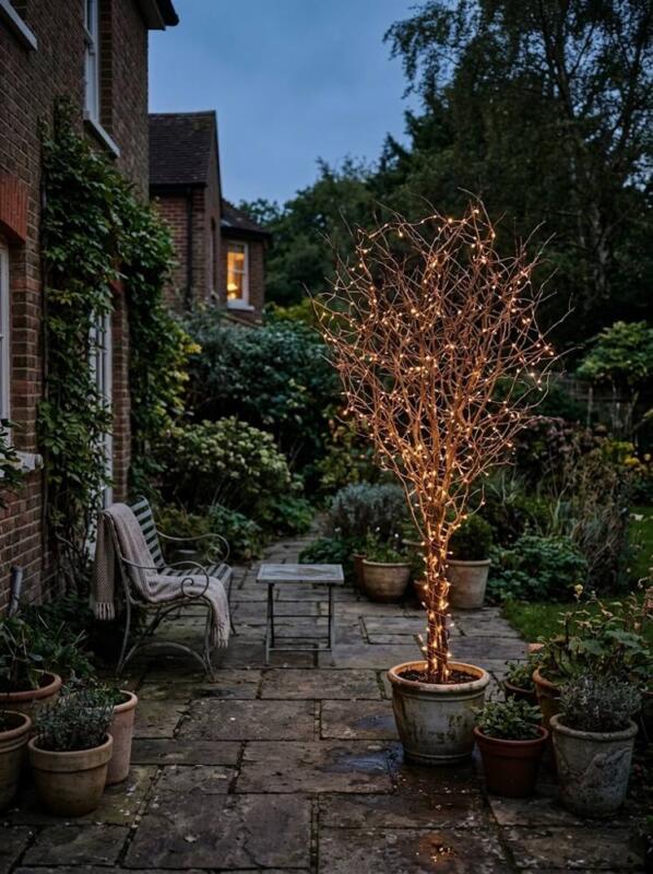 A Twig Tree with Copper Lights – outdoor Christmas tree idea for UK gardens and porches