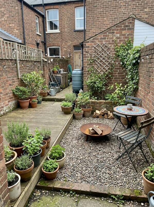 Decking and Gravel with a Fire Bowl – budget patio idea for UK gardens