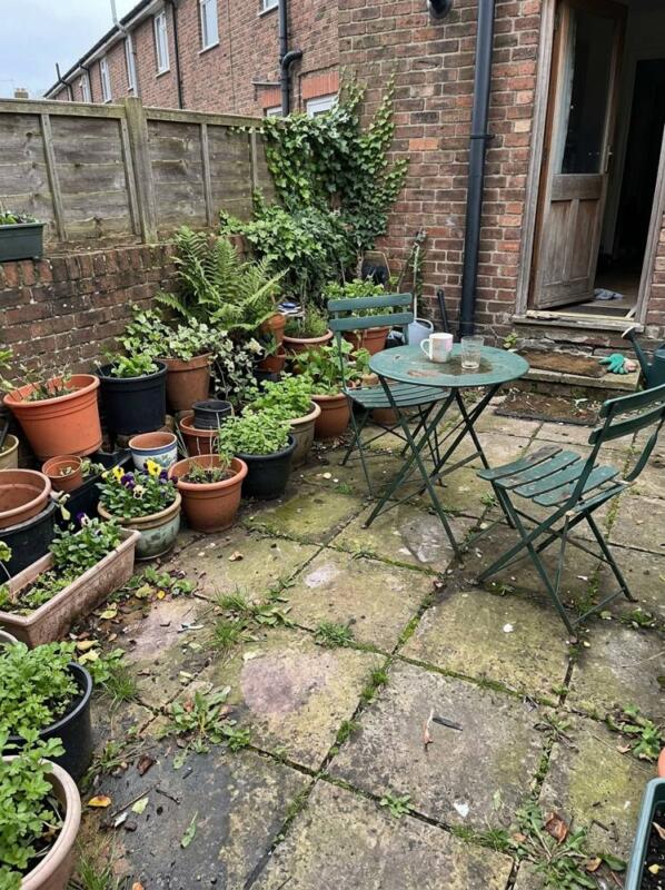 A Mosaic Table and Potted Herbs – budget patio idea for UK gardens