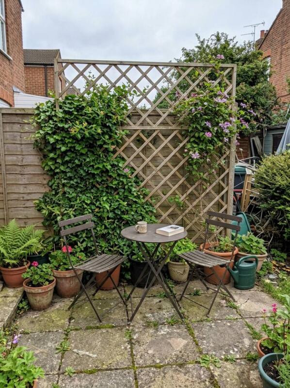 A Trellis Screen behind the Seating – budget patio idea for UK gardens