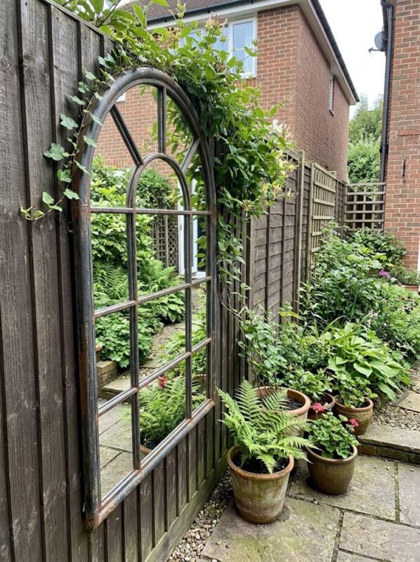 A Garden Mirror on the Fence – budget small backyard idea for UK gardens