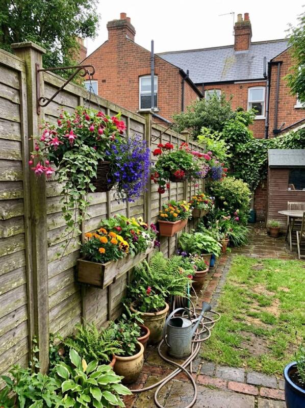 Hanging Baskets and Window Boxes on the Fence – budget small backyard idea for UK gardens