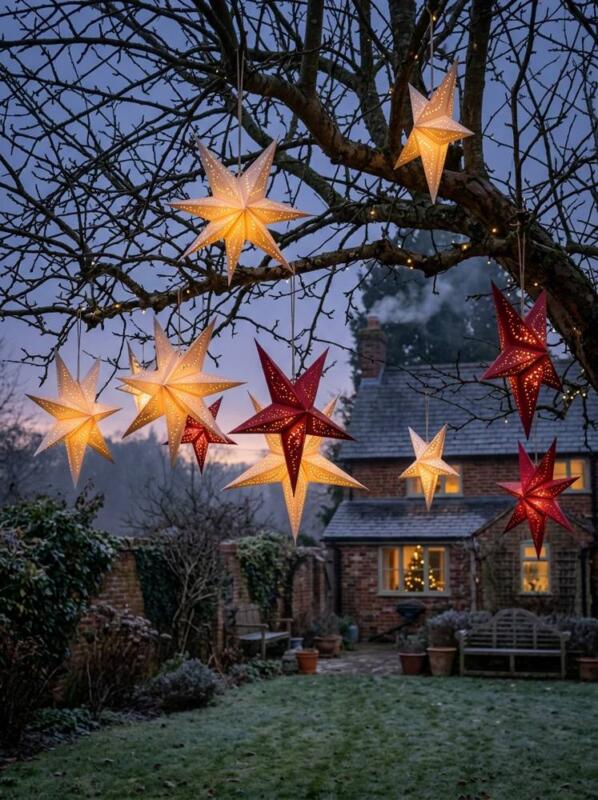 Paper Star Lanterns in a Tree – outdoor Christmas lights idea for UK gardens